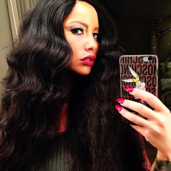 New Hair Alert: Amber Rose Wears Long, Brown Weave